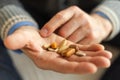 Hands with pills. Senior man hands holding medical pill. Mature old senior grandfather taking medication cure pills Royalty Free Stock Photo