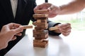 Hands playing blocks wood game, gambling placing wooden block. Concept Risk of management and strategy plan