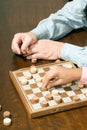 Hands Playing Chess