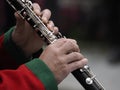 Hands playing clarinet detail