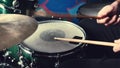 Hands playing drums with drumsticks with rock beat, hihat rythm