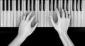 Hands playing piano