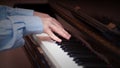 Hands playing on a piano