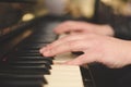 Hands playing the piano (close-up) with oldschool vintage instagram filter