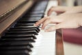 Hands playing piano