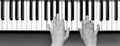 Pianist, hands close-up on piano keys, black and white shot Royalty Free Stock Photo