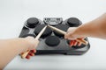 Hands playing on portable electronic drums Royalty Free Stock Photo