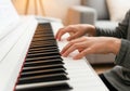 Hands Playing a White Digital Piano Royalty Free Stock Photo