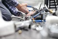 Hands plumber at work in a bathroom, plumbing repair service, as Royalty Free Stock Photo