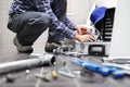 Hands plumber at work in a bathroom, plumbing repair service, as Royalty Free Stock Photo