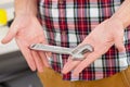 Hands of Plumber with a wrench Royalty Free Stock Photo