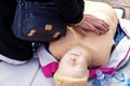 Hands of a Policeman on a mannequin during an exercise of resuscitation. Royalty Free Stock Photo