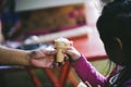 The hands of the poor handed a plate to receive food from volunteers to alleviate hunger, the concept of helping the homeless Royalty Free Stock Photo