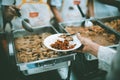 The hands of the poor have been begging to donate food from the donor, The concept of feeding Royalty Free Stock Photo