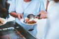 The hands of the poor have been begging to donate food from the donor : the concept of feeding Royalty Free Stock Photo