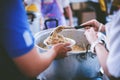 The hands of the poor have been begging to donate food from the donor : the concept of feeding Royalty Free Stock Photo