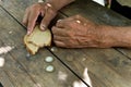 Hands the poor old man& x27;s, piece of bread and change, pennies on Royalty Free Stock Photo