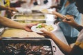 The Hands of the Poor Receive Charity Food Service from Volunteers :  The Concept of Poverty and Hungry Royalty Free Stock Photo