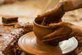 Hands of a potter, creating an earthen jar on the circle. Woman makes hand made ceramics from clay Royalty Free Stock Photo