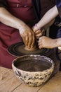 Hands of a potter forming clay