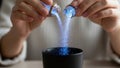 Hands Pour Blue Powder Into Cup During Science Experiment Royalty Free Stock Photo