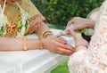 Hands pouring blessing water into bride`s bands, Thai wedding Royalty Free Stock Photo