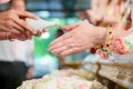 Hands pouring blessing water into bride`s bands, Thai wedding. Royalty Free Stock Photo