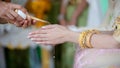 Hands pouring blessing water into bride`s bands, Thai wedding.Wedding ceremony in Thailand. Royalty Free Stock Photo