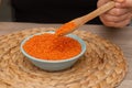 Hands Pouring Red Lentils into Bowl. Hands overflowing with vibrant red lentils over a bowl