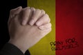 Hands pray for Brussels with Belgian flag Royalty Free Stock Photo