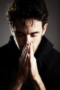 Hands, pray and man praise God with gratitude and respect for religion on grey background. Guide, wellness and prayer Royalty Free Stock Photo