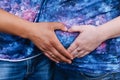 Hands on pregnant woman belly