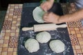 Hands prepare homemade baguettes