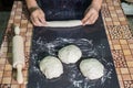 Hands prepare homemade baguettes