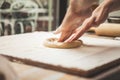 Hands preparing dough basis for pizza Royalty Free Stock Photo