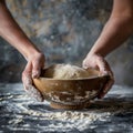 Hands preparing dough closeup, dough in a bowl on rustic kitchen table, hands making pizza, bread Royalty Free Stock Photo