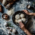 Hands preparing dough closeup, dough in a bowl on rustic kitchen table, hands making pizza, bread Royalty Free Stock Photo