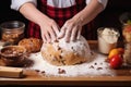 hands preparing homemade panettone dough on a wooden board