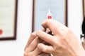Hands preparing injection syringe against backdrop of medical certificates Royalty Free Stock Photo