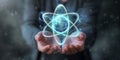 Hands presenting a glowing atom model
