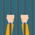 Hands of prisoner behind bars. Royalty Free Stock Photo