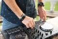 Hands of a professional DJ on the controller mix music Royalty Free Stock Photo