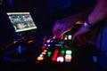 Hands of a professional DJ playing and mixing music for a slumber party Royalty Free Stock Photo