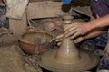 Hands of Professional Thai man using mechanic pottery made earthenware at `Koh Kret` in Thailand