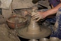 Hands of Professional Thai man using mechanic pottery made earthenware at `Koh Kret` in Thailand