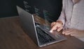 Hands of a programmer types on a laptop displaying programming code, symbolizing coding tech, software development, web Royalty Free Stock Photo