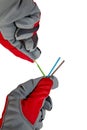 Hands in protective gloves and electric cable isolated on white background Royalty Free Stock Photo