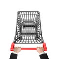 Hands pushing 3D empty shopping cart high angle view