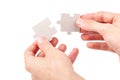 Hands putting together, connecting two matching blank jigsaw puzzle pieces, joining corresponding fitting parts, elements isolated Royalty Free Stock Photo