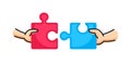 Hands putting two puzzle pieces together. Family concept. Business, teamwork and partnership concept